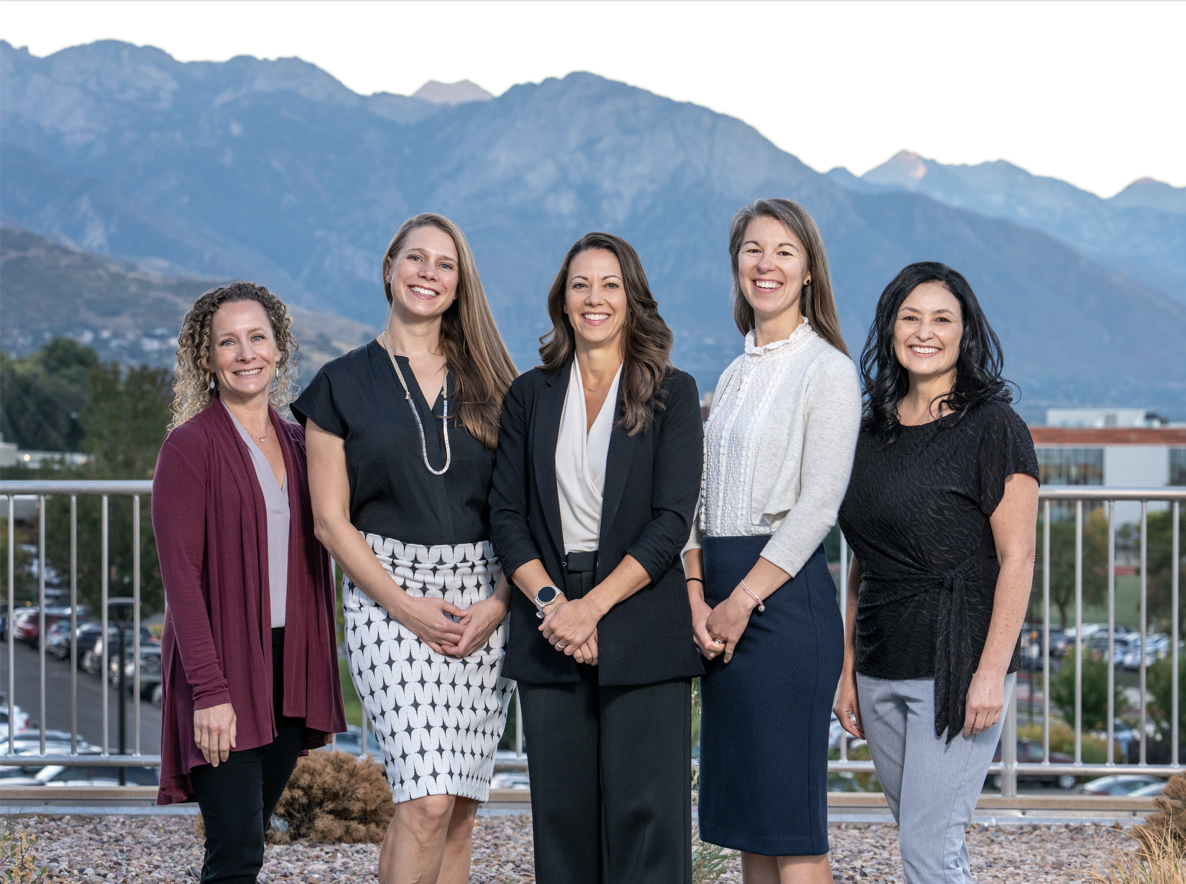 Urogynecology division group photo of female providers smiling with mountains in the background